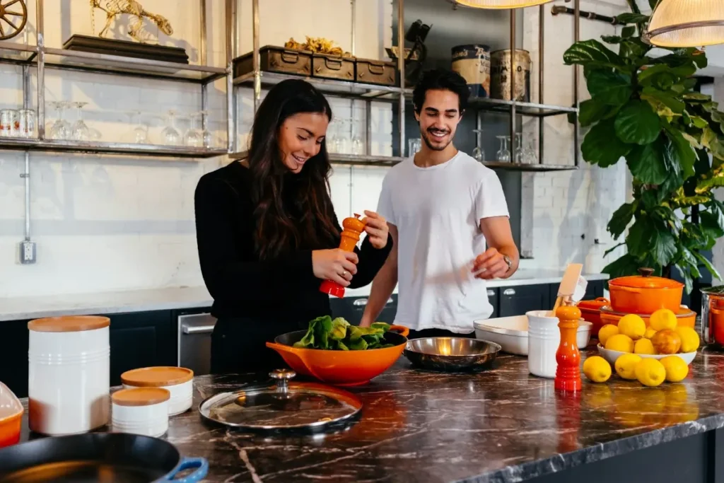 Couple cooking together - weekend self care ideas