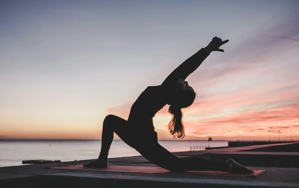 Woman doing yoga - fitness tips 2026