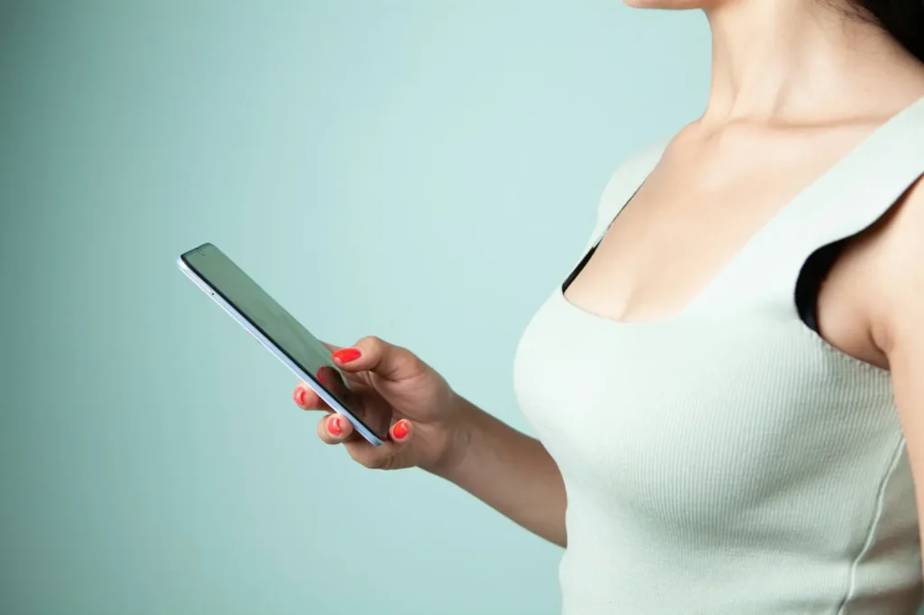 Woman watching reels on mobile - short videos vs TV